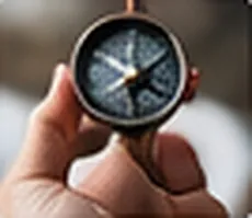 Hand holding a compass