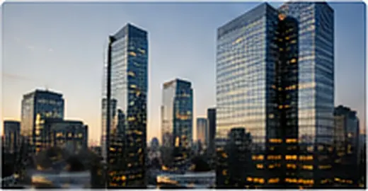 City skyline of corporate office towers at dusk
